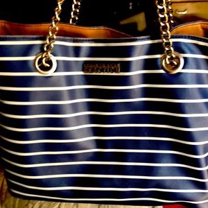 It’s a blue and white Kenneth Cole handbag shoulder bag
